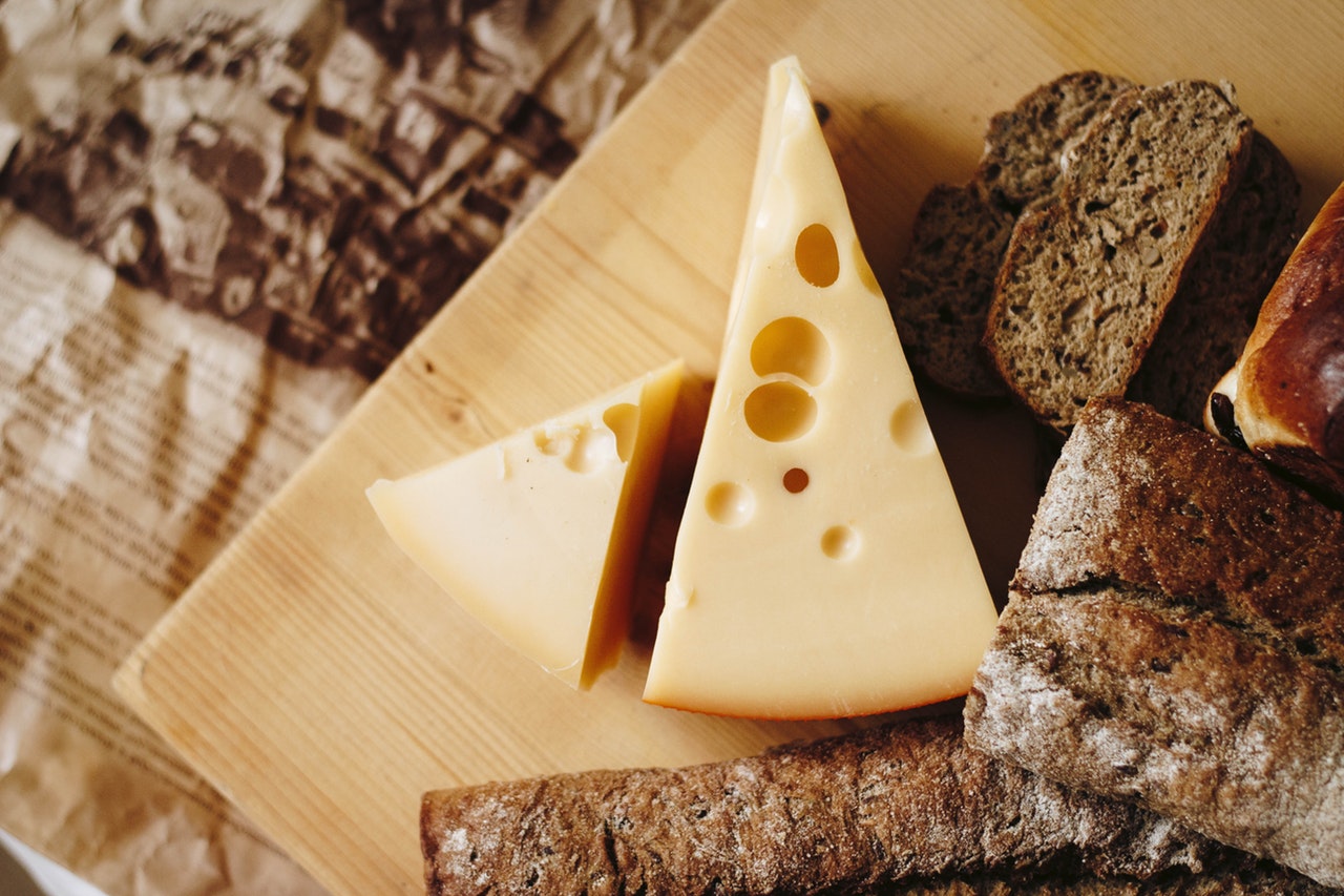 sliced-cheese-on-brown-table-top-821365.jpg.jpg