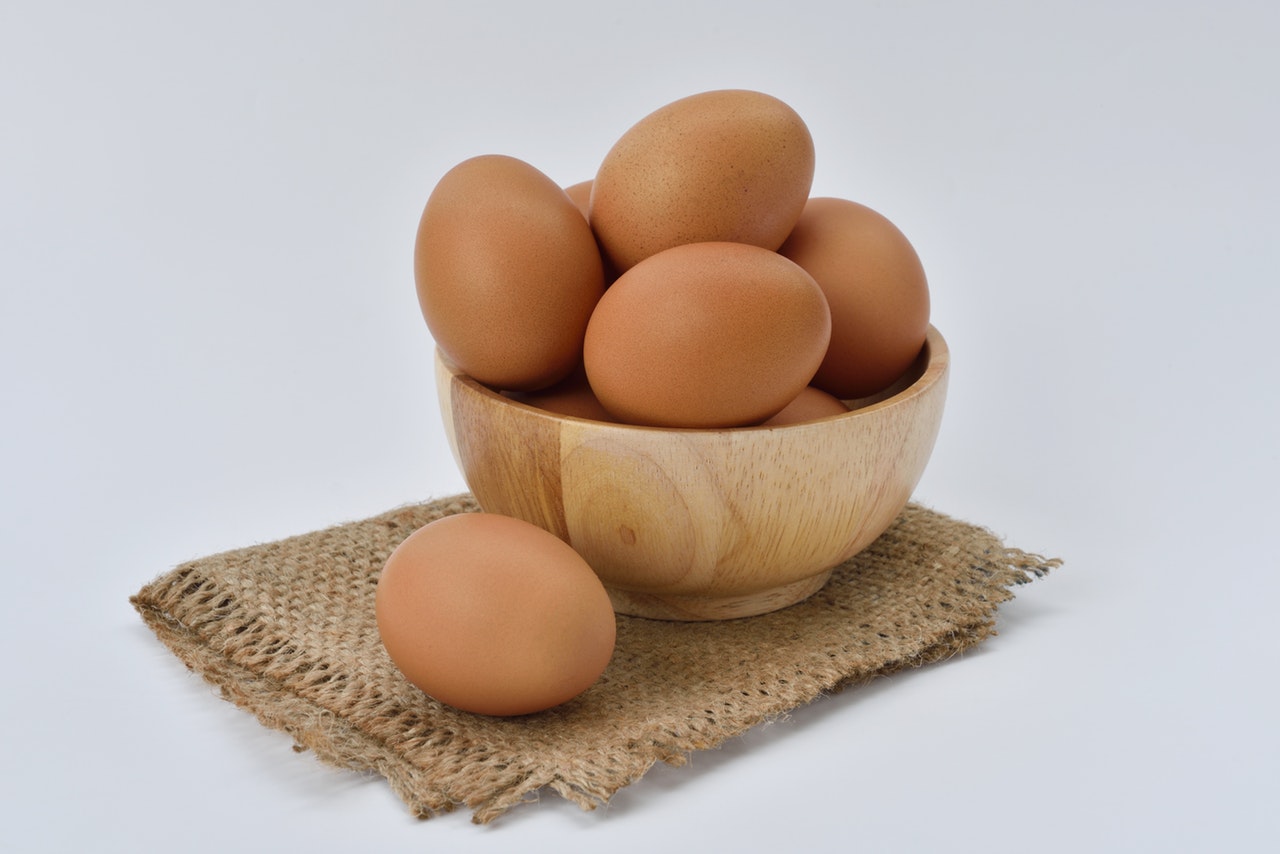 brown-eggs-on-brown-wooden-bowl-on-beige-knit-textile-162712.jpg.jpg