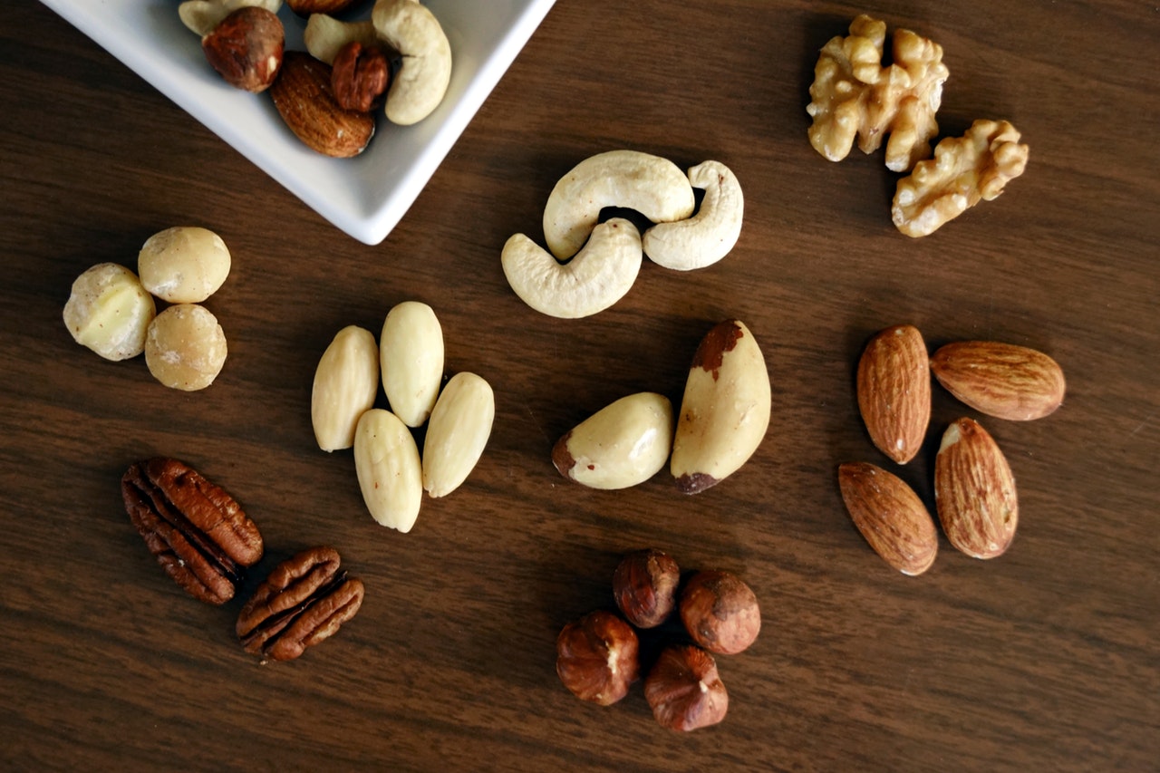variety-of-brown-nuts-on-brown-wooden-panel-high-angle-photo-1295572.jpg.jpg
